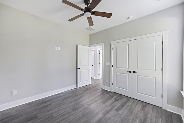 621 Plantation Dr, Santee, SC 29142 - unfurnished bedroom featuring a ceiling fan, baseboards, a closet, and dark wood-style flooring