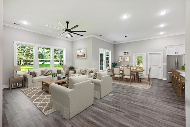 living room with ceiling fan, crown molding, and dark hardwood / wood-style flooring