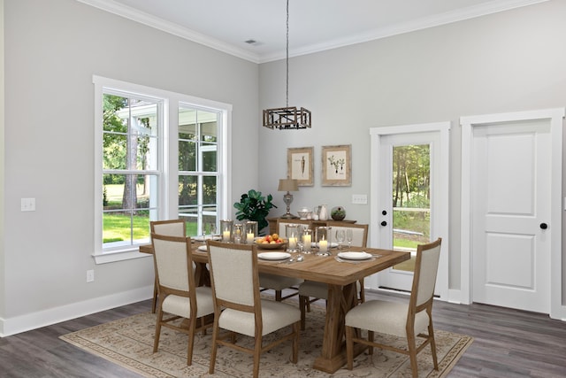 dining space featuring ornamental molding, dark wood-type flooring, and plenty of natural light