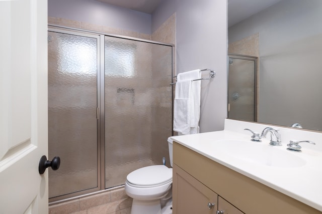 bathroom featuring an enclosed shower, tile patterned flooring, toilet, and vanity