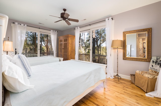 bedroom with hardwood / wood-style floors and ceiling fan