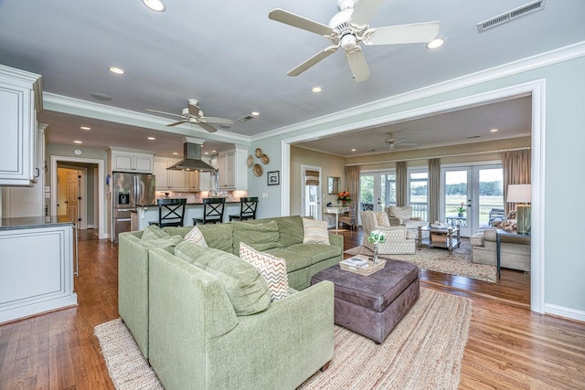 1227 River Rd, Johns Island, SC 29455 - living area with ceiling fan, crown molding, wood finished floors, recessed lighting, and baseboards
