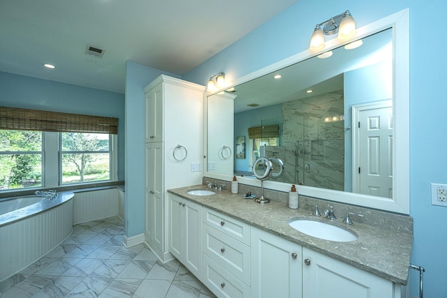 1227 River Rd, Johns Island, SC 29455 - full bathroom featuring marble look tile flooring, double vanity, a stall shower, a garden tub, and recessed lighting