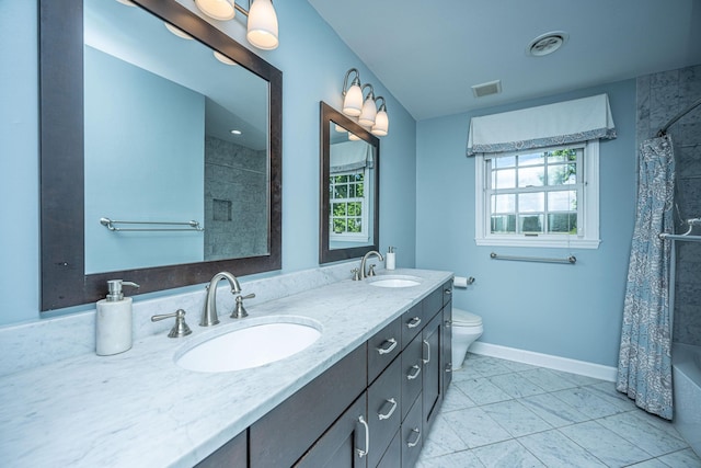 1227 River Rd, Johns Island, SC 29455 - full bath with double vanity, toilet, baseboards, tile patterned floors, and shower / bath combination with curtain