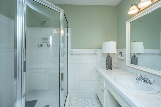 1227 River Rd, Johns Island, SC 29455 - full bath featuring a shower stall, vanity, tile patterned floors, tile walls, and wainscoting