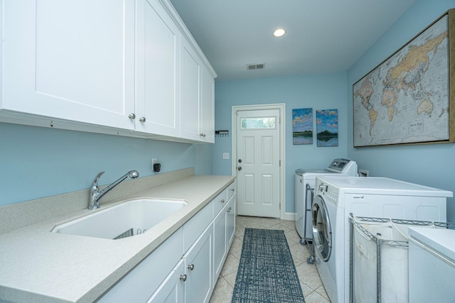1227 River Rd, Johns Island, SC 29455 - laundry room with cabinet space, washer and dryer, light tile patterned floors, and recessed lighting