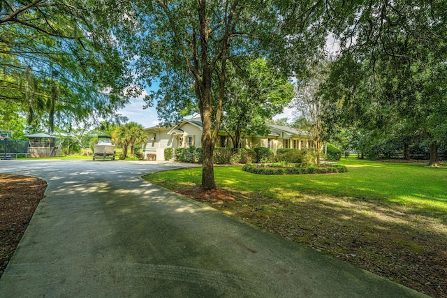 1227 River Rd, Johns Island, SC 29455 - view of front facade with driveway and a front yard
