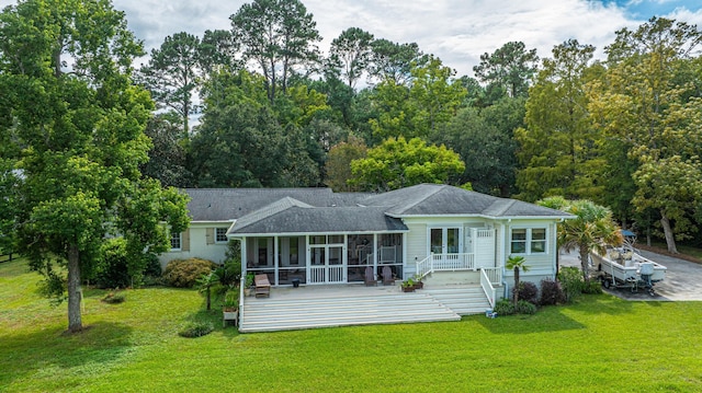 1227 River Rd, Johns Island, SC 29455 - back of property featuring a sunroom, a yard, a shingled roof, and a wooden deck