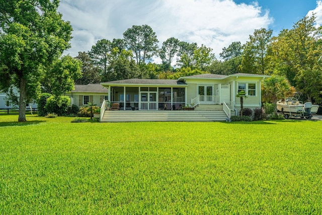 1227 River Rd, Johns Island, SC 29455 - back of property with a sunroom and a lawn