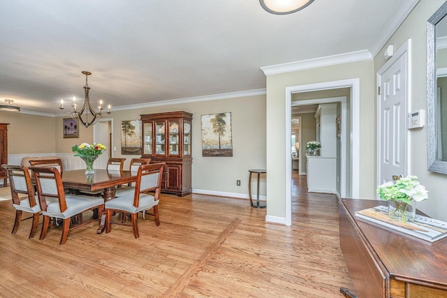 1227 River Rd, Johns Island, SC 29455 - dining room featuring a chandelier, light wood-type flooring, ornamental molding, and baseboards