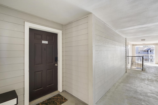 entrance to property featuring covered porch