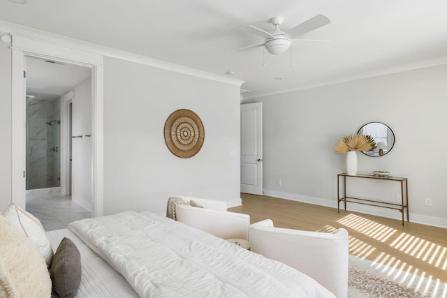 bedroom featuring ornamental molding, light wood-style flooring, baseboards, and a ceiling fan