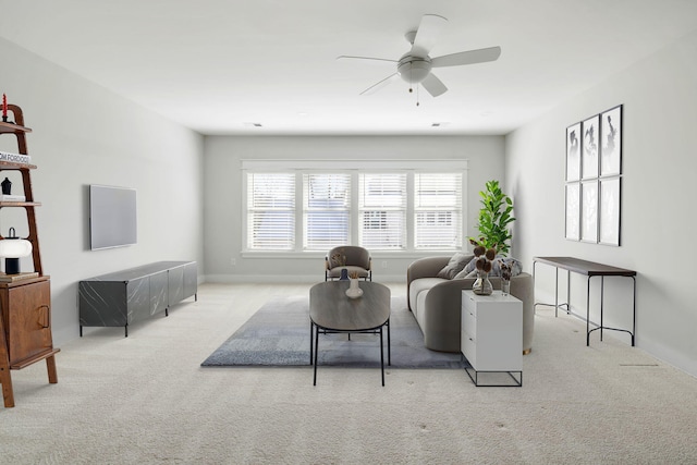 carpeted living room featuring ceiling fan