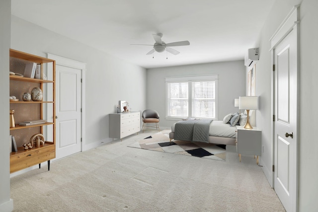 bedroom with carpet floors, ceiling fan, and a wall unit AC