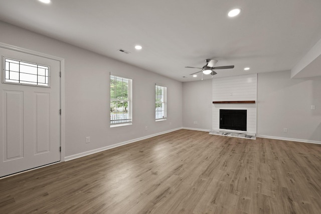 unfurnished living room with visible vents, recessed lighting, ceiling fan, and wood finished floors