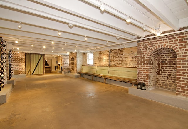 basement with brick wall