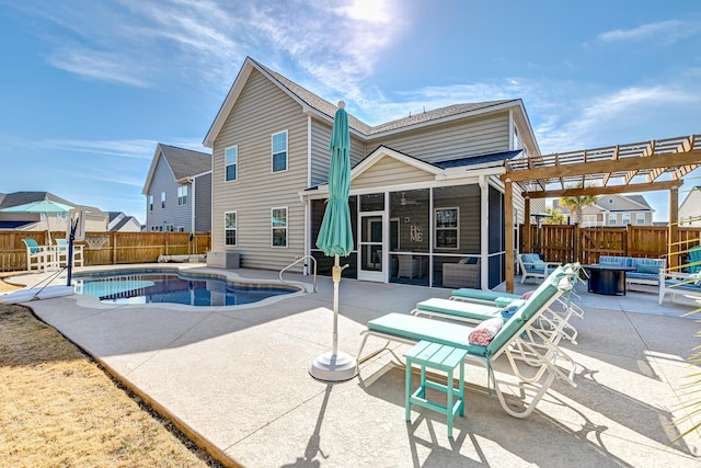 view of pool with a fenced in pool, a patio, a sunroom, a pergola, and a fenced backyard