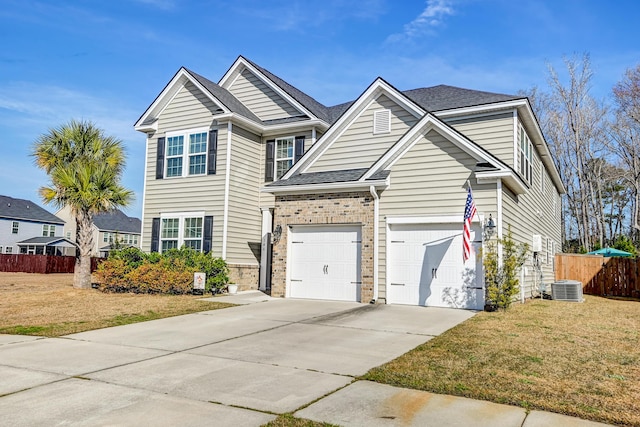 traditional home with driveway, brick siding, fence, central AC, and a front yard