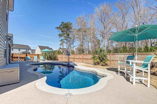 view of swimming pool featuring a patio, outdoor dining area, a fenced backyard, and a fenced in pool