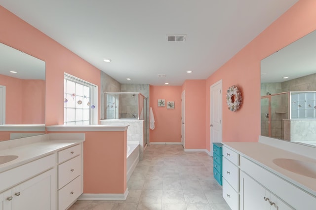 bathroom with a sink, two vanities, a shower stall, and visible vents