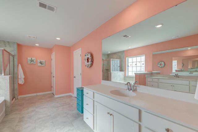 bathroom featuring two vanities, visible vents, a sink, and a shower stall