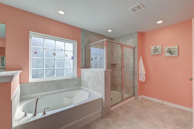 bathroom featuring a stall shower, baseboards, visible vents, a bath, and recessed lighting