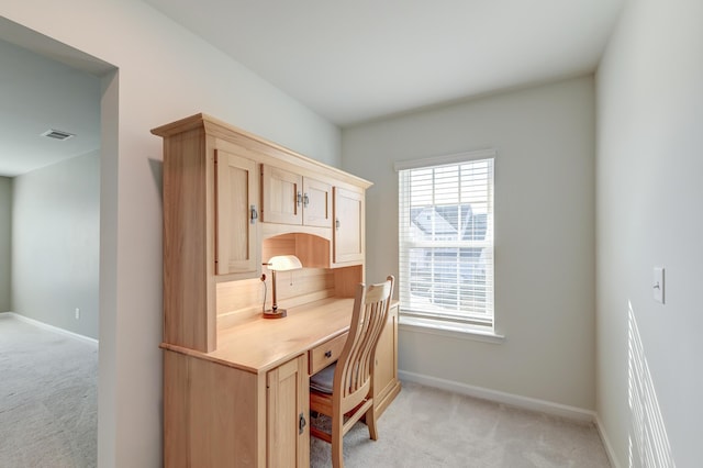 office area featuring light carpet, visible vents, and baseboards