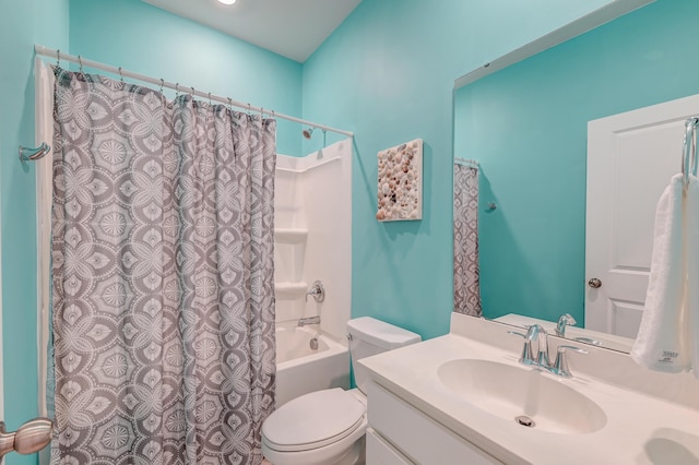 full bath with shower / bath combo, vanity, and toilet