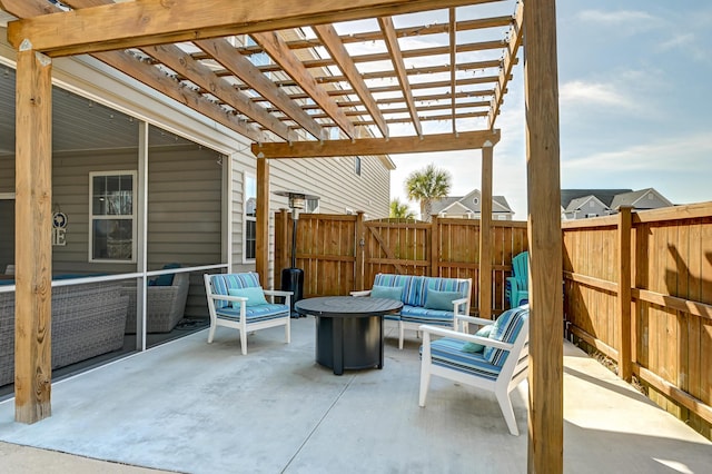 view of patio / terrace with an outdoor living space with a fire pit, fence, and a pergola