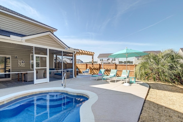 view of swimming pool featuring a fenced in pool, a sunroom, a patio area, a pergola, and a fenced backyard