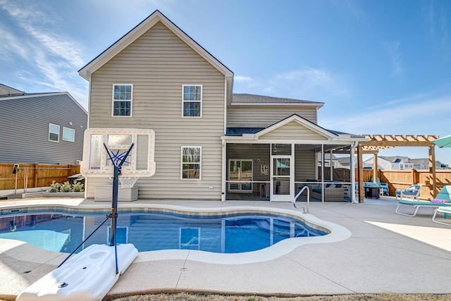 view of pool with a fenced in pool, a patio, a sunroom, a fenced backyard, and a pergola