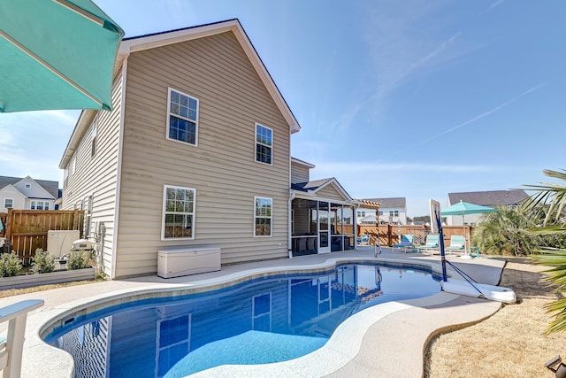 view of pool featuring a fenced in pool, fence, and a patio