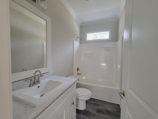 full bathroom with shower / bathtub combination, wood-type flooring, ornamental molding, vanity, and toilet