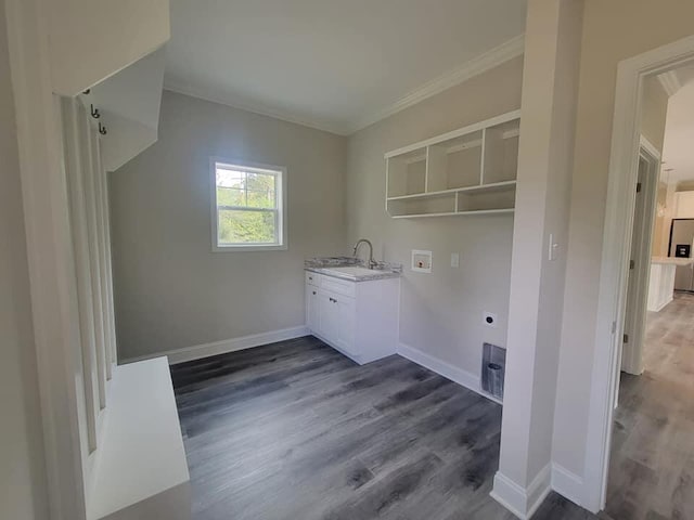 clothes washing area with crown molding, washer hookup, dark hardwood / wood-style flooring, sink, and electric dryer hookup