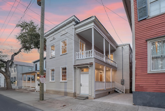 view of front of house with a balcony