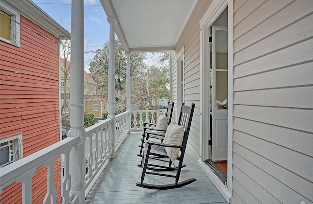 balcony featuring a porch