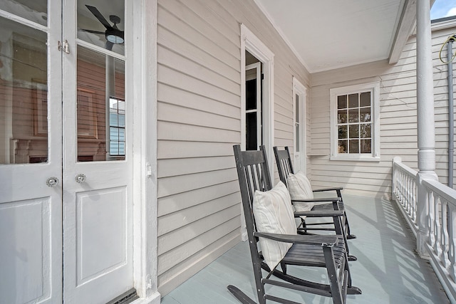 balcony featuring french doors and a porch