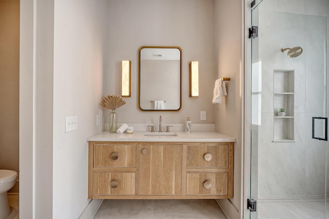 full bath featuring a stall shower, toilet, and vanity