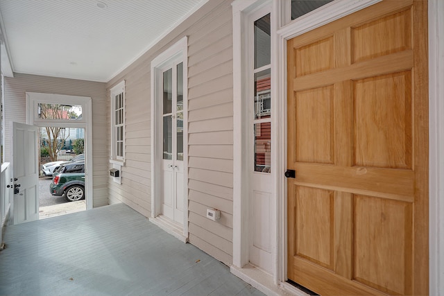 entrance to property featuring covered porch