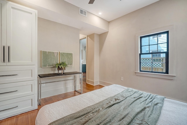 bedroom featuring baseboards, visible vents, light wood-style flooring, recessed lighting, and ceiling fan