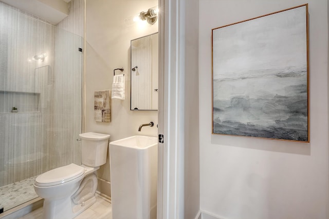 bathroom featuring a walk in shower and toilet