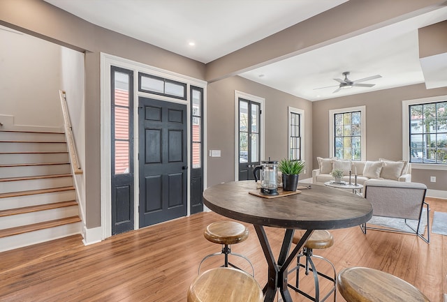 foyer featuring baseboards, recessed lighting, ceiling fan, stairs, and light wood-type flooring