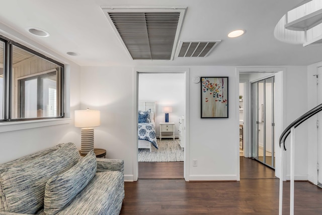 sitting room featuring recessed lighting, visible vents, baseboards, and wood finished floors