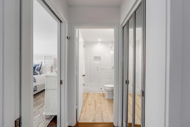 corridor featuring wood finished floors