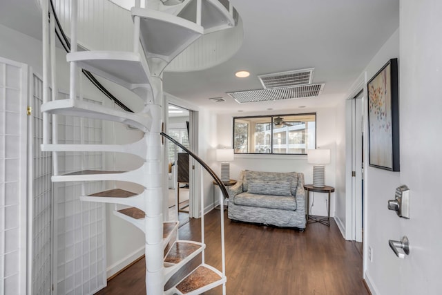 foyer featuring stairway, baseboards, and wood finished floors