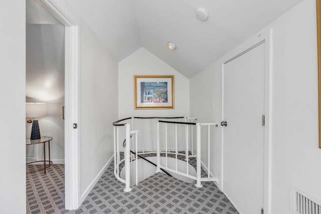 bonus room with visible vents, baseboards, and lofted ceiling