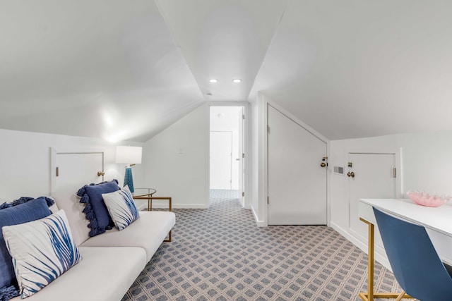 interior space with vaulted ceiling, recessed lighting, and baseboards