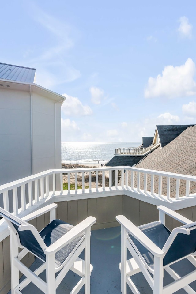 balcony featuring a water view