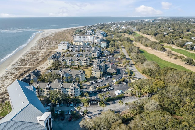 bird's eye view with a water view and a beach view