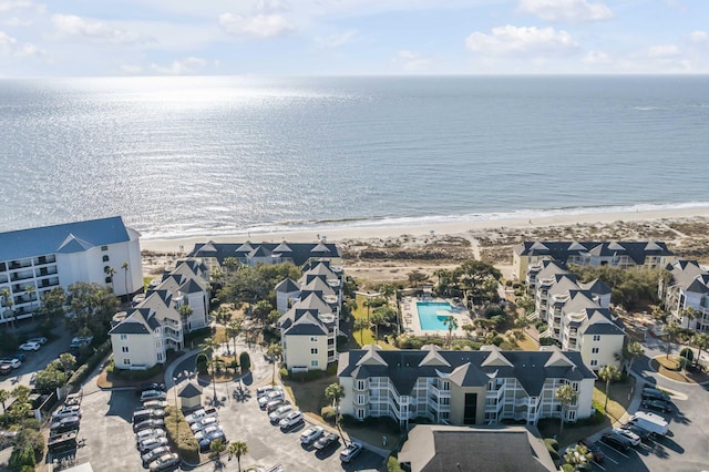 birds eye view of property with a view of the beach and a water view